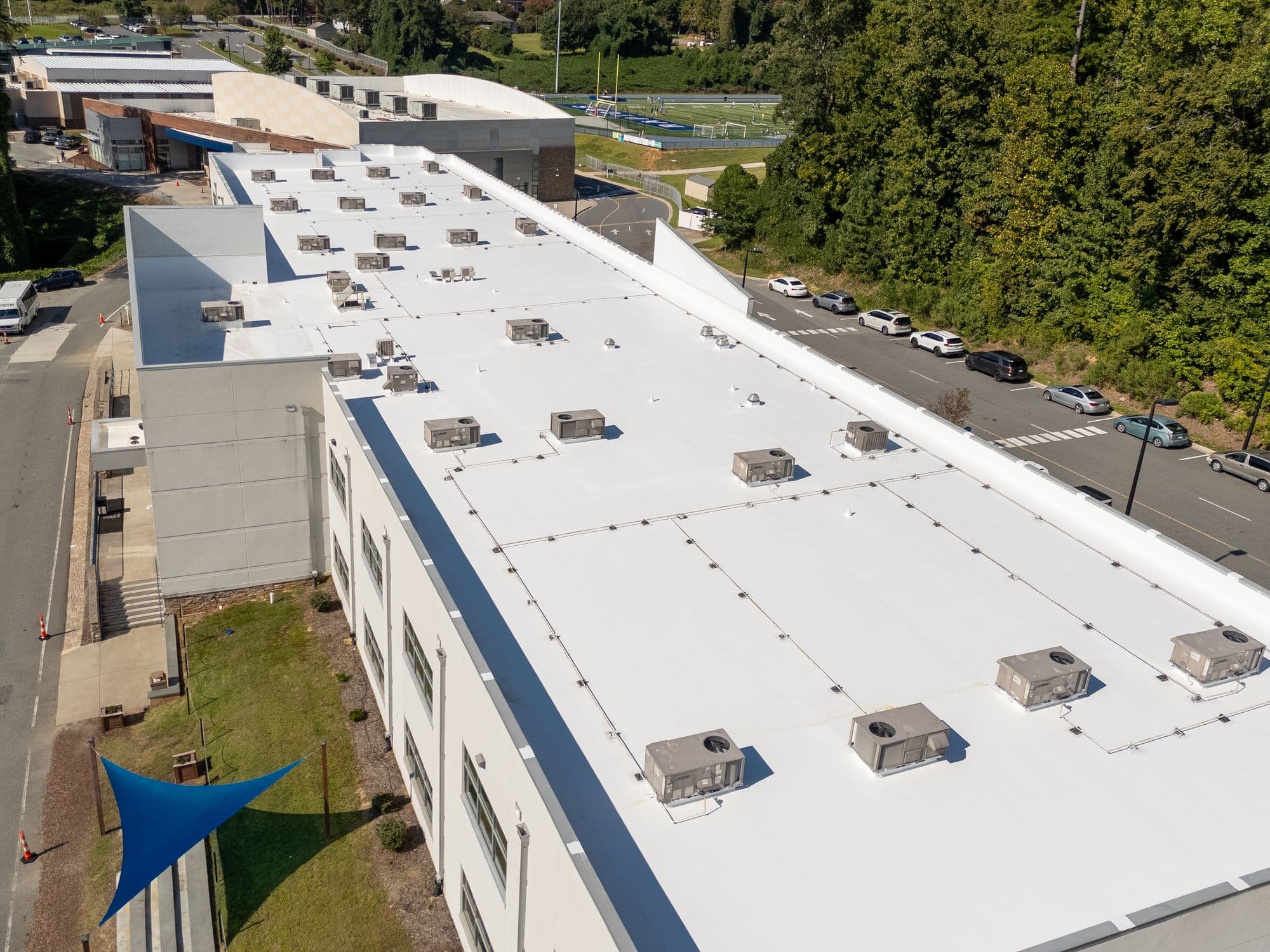 Aerial view of Mountain Island Charter School commercial roof coating restoration in Charlotte NC
